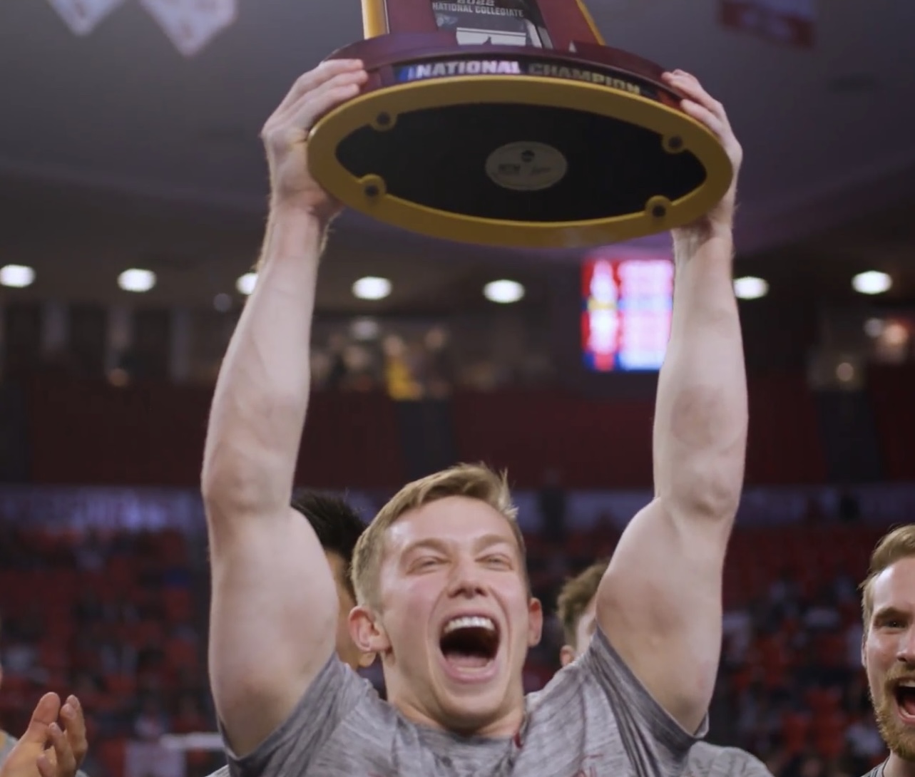 Ian Gunther raising the NCAA championship trophy